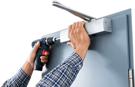 Commercial Locksmith Installing Door Closer